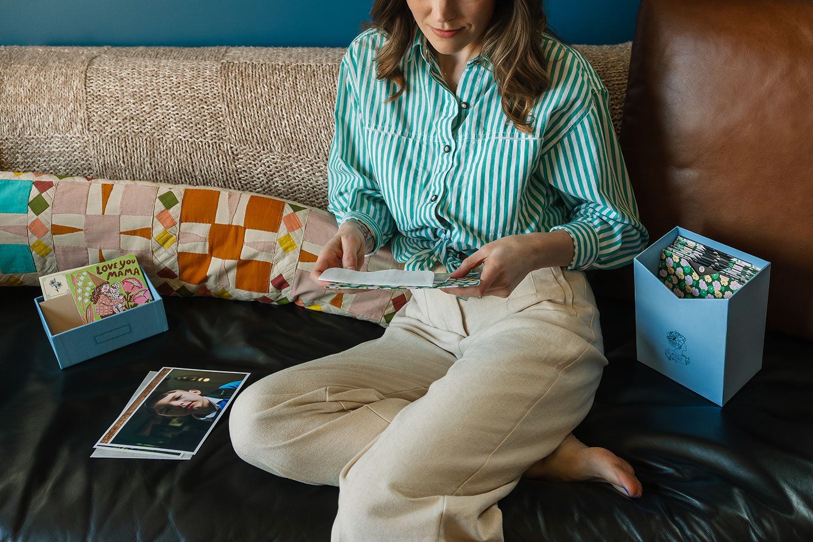 A lady looking at printed photos